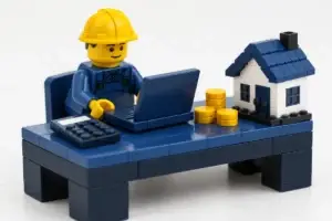 Couvreur en briques devant un ordinateur et une calculatrice