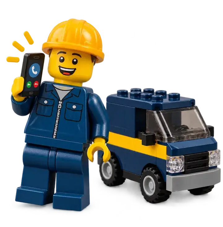 Plombier Lego souriant avec un téléphone qui sonne, devant sa camionnette