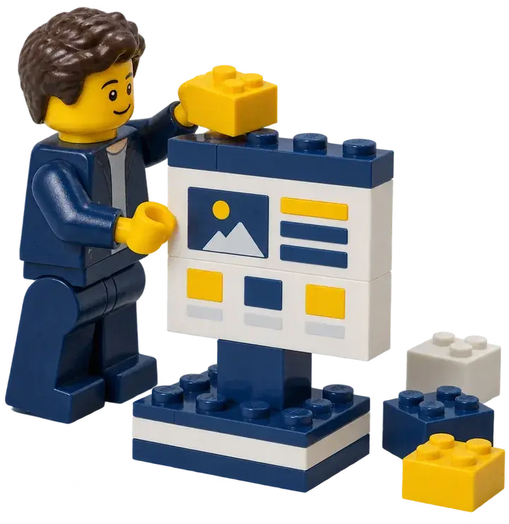 Personnage Lego qui assemble un écran de site en briques